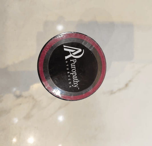 Puropathy Ayurveda Womax supplement container with black and pink branding.